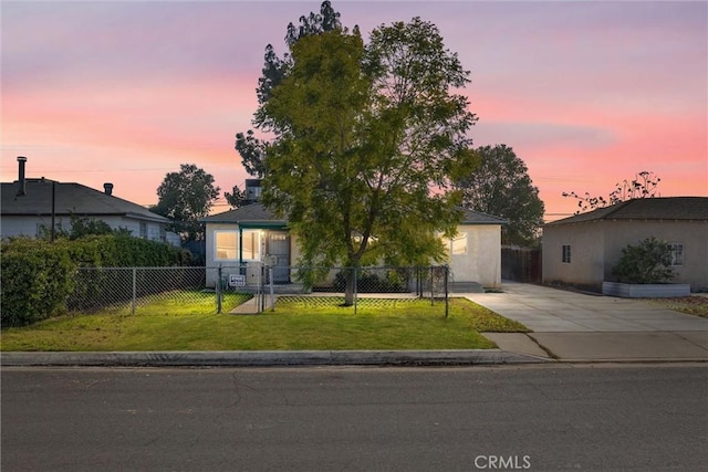 view of front of property with a lawn