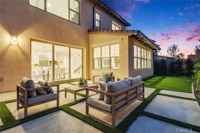 exterior space with outdoor lounge area and a lawn