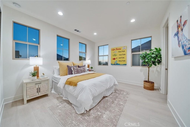 bedroom with light hardwood / wood-style flooring