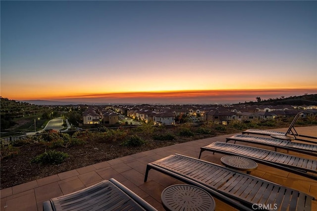 view of patio terrace at dusk