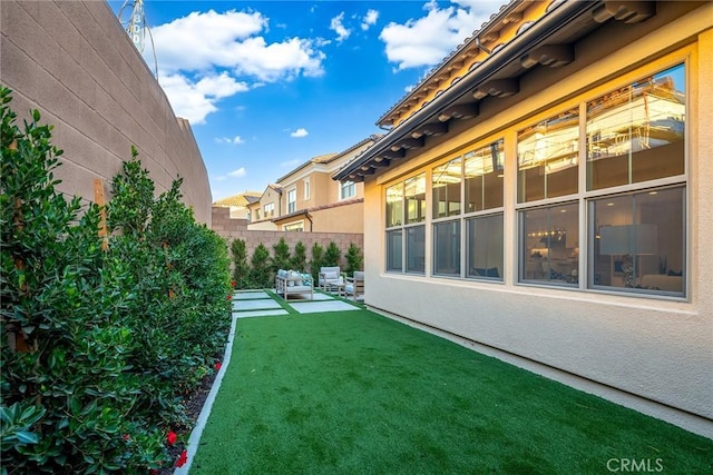 view of yard featuring an outdoor living space and a patio