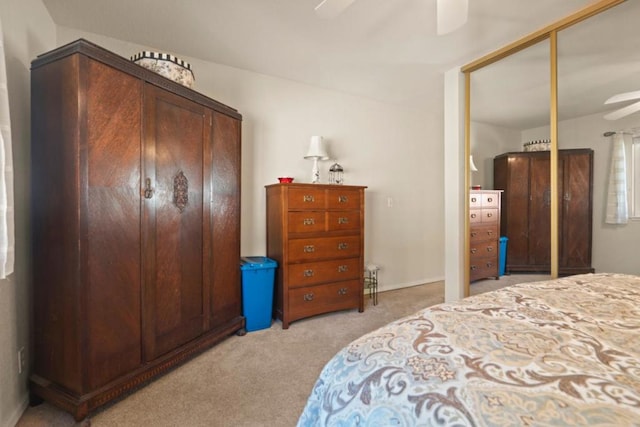 bedroom with light colored carpet and ceiling fan