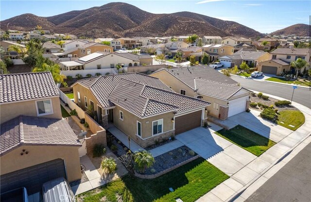 birds eye view of property with a mountain view