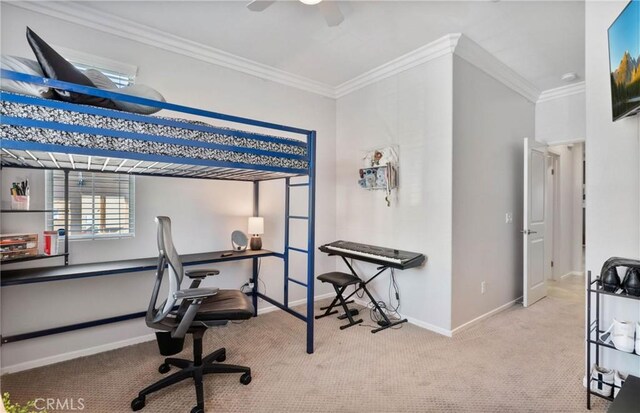 carpeted bedroom with ceiling fan and ornamental molding