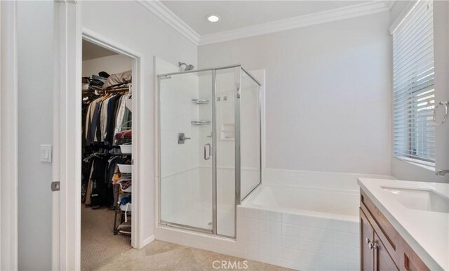 bathroom featuring vanity, ornamental molding, separate shower and tub, and tile patterned flooring