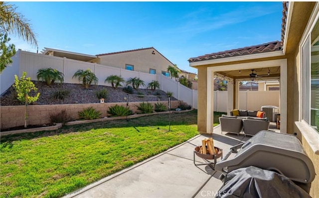 view of patio / terrace with ceiling fan and an outdoor living space