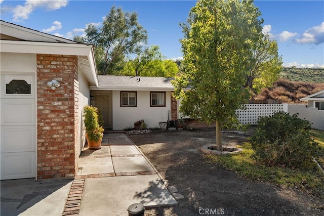 view of side of property with a garage