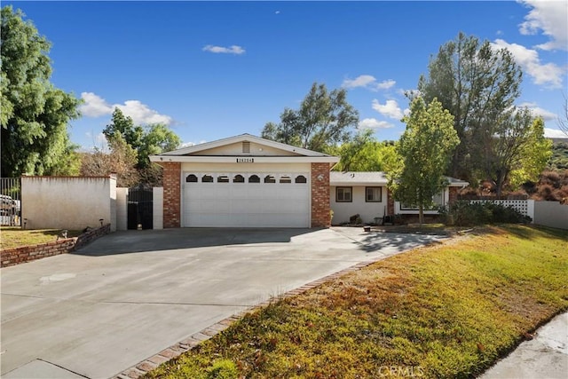 ranch-style house with a front lawn and a garage