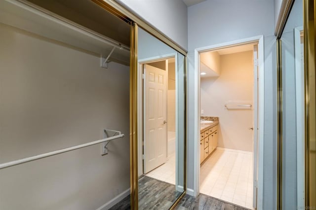 bathroom featuring hardwood / wood-style floors and vanity