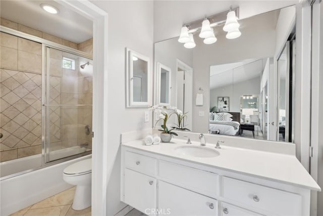 full bathroom featuring tile patterned floors, vanity, bath / shower combo with glass door, toilet, and vaulted ceiling