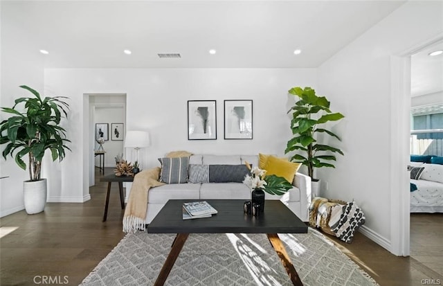 living room featuring dark hardwood / wood-style floors