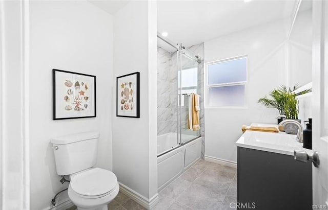 full bathroom with toilet, vanity, and shower / bath combination with glass door