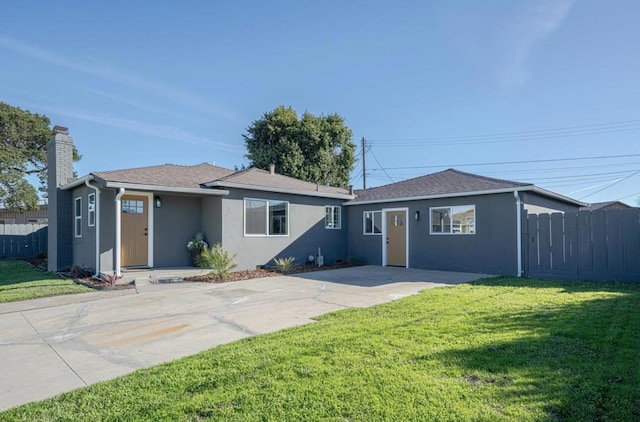 single story home featuring a front yard