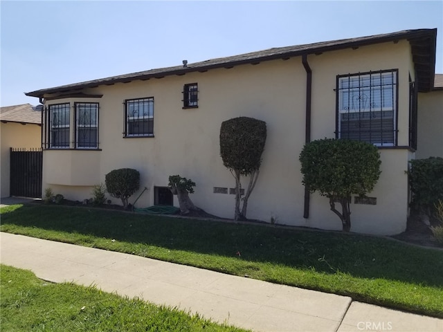 view of property exterior featuring a yard