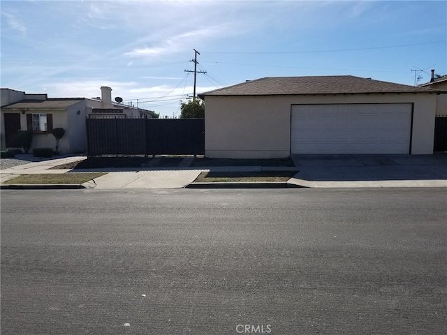 view of property exterior featuring an outbuilding and a garage