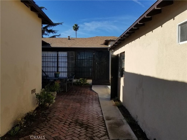 view of side of property with a patio