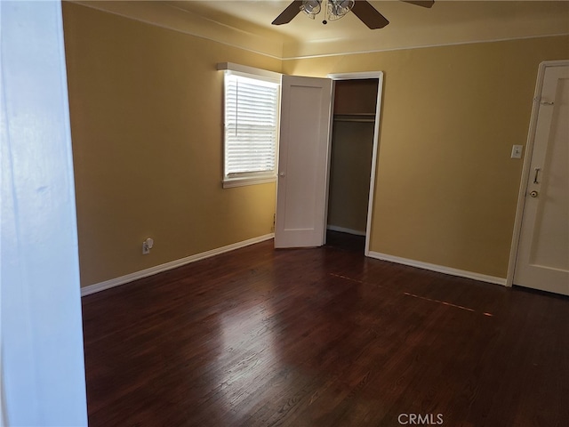 unfurnished bedroom with a closet, ceiling fan, and dark hardwood / wood-style floors