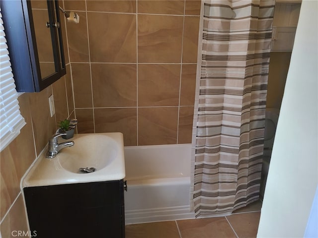 bathroom with tile patterned flooring, vanity, and shower / bathtub combination with curtain