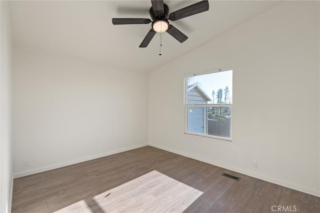 unfurnished room featuring ceiling fan, lofted ceiling, and hardwood / wood-style flooring