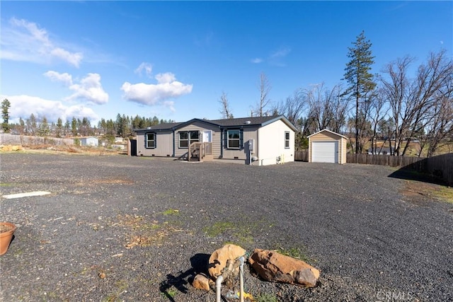 view of front of home featuring an outbuilding and a garage