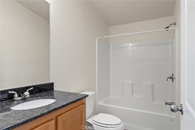 full bathroom featuring toilet, vanity, and bathtub / shower combination