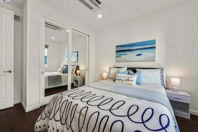 bedroom with dark wood-type flooring