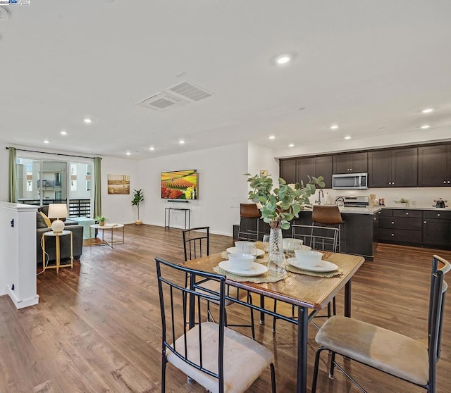 dining space featuring hardwood / wood-style flooring