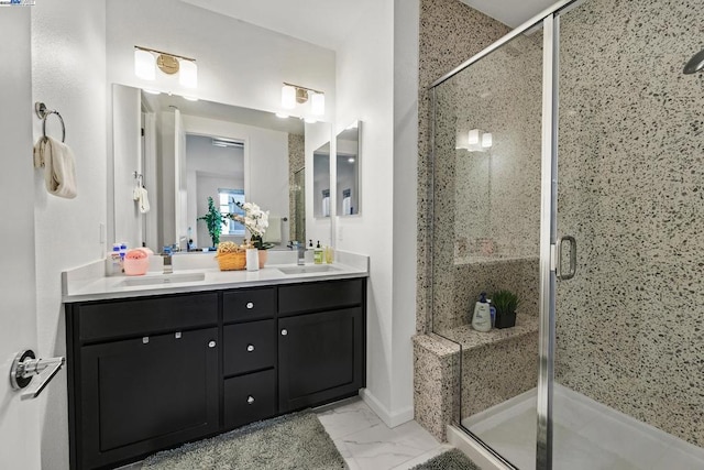 bathroom featuring vanity and a shower with door