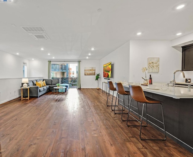 interior space featuring dark wood-type flooring and sink