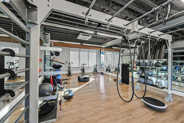 workout area featuring basketball court and hardwood / wood-style floors