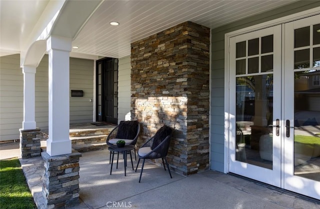 view of patio with french doors and covered porch