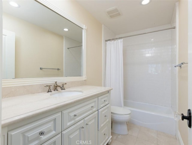 full bathroom featuring toilet, vanity, tile patterned flooring, and shower / tub combo with curtain