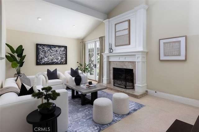 living room with a high end fireplace, vaulted ceiling with beams, and carpet floors