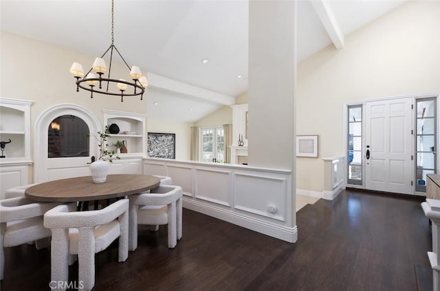 dining room with dark wood-type flooring, a chandelier, built in features, and vaulted ceiling with beams