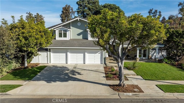 view of front facade with a front lawn and a garage