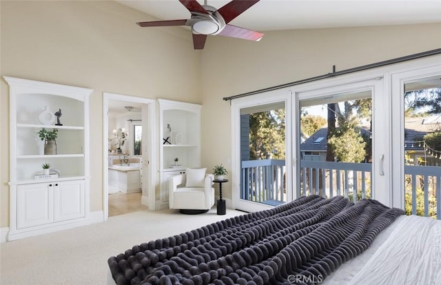 bedroom featuring access to exterior, connected bathroom, vaulted ceiling, and light colored carpet