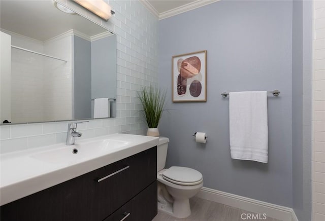 bathroom with toilet, decorative backsplash, walk in shower, ornamental molding, and vanity