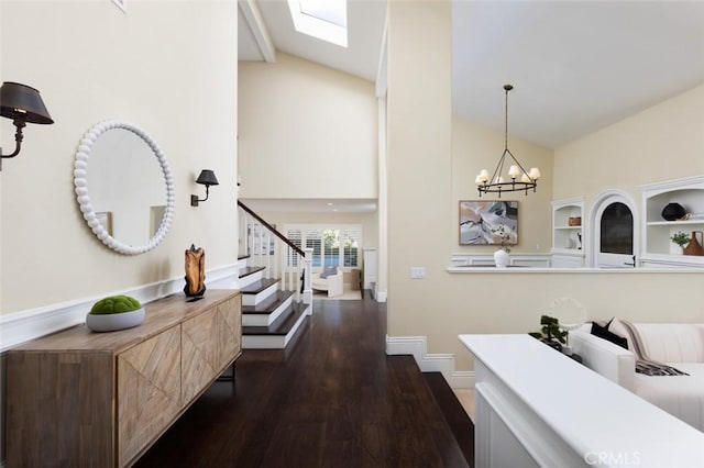 hall featuring vaulted ceiling, dark hardwood / wood-style floors, and an inviting chandelier