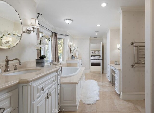 bathroom featuring vanity, tile patterned flooring, and ornamental molding