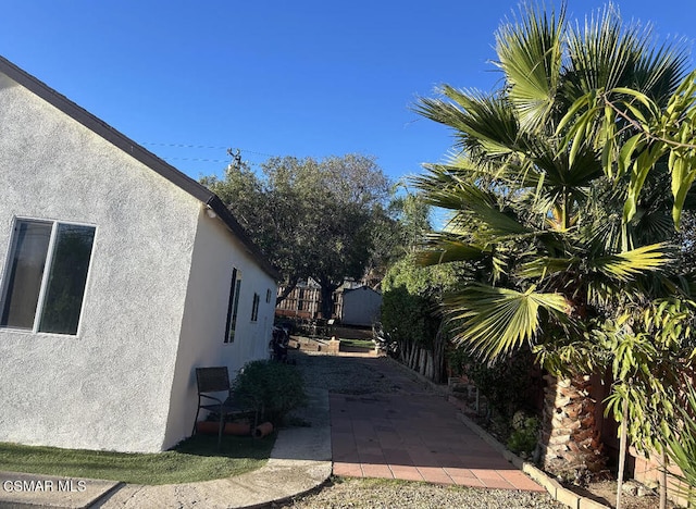 view of property exterior with a patio