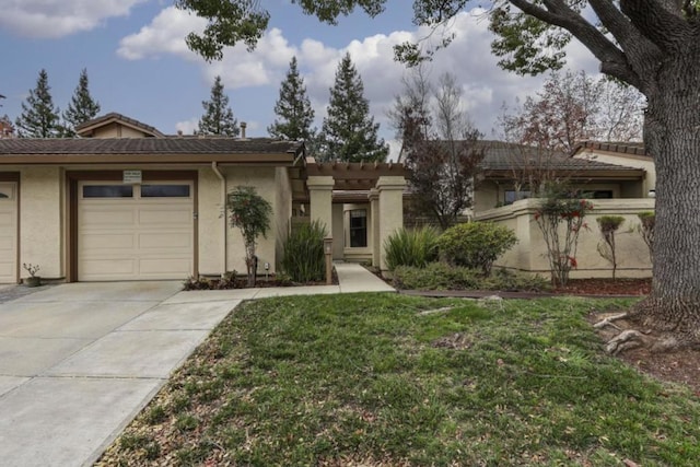 ranch-style home with a garage and a front yard