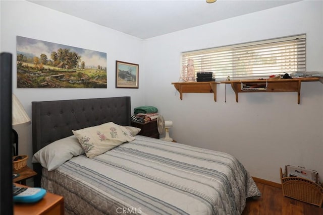 bedroom featuring dark hardwood / wood-style floors