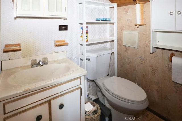 bathroom with toilet and vanity