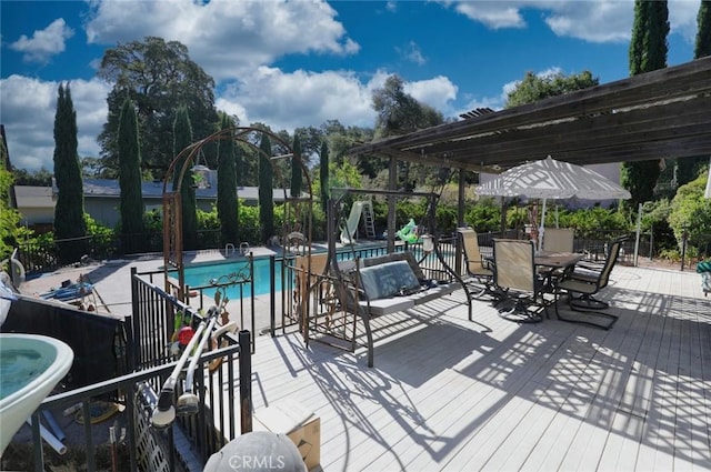 view of pool featuring a deck and a pergola