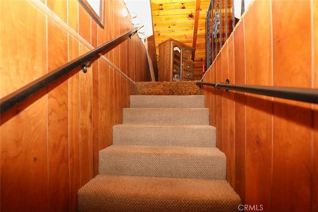 stairway with wooden walls