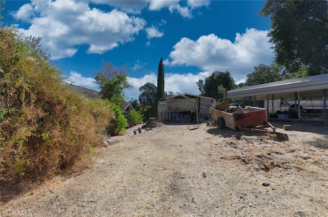 view of yard featuring a carport