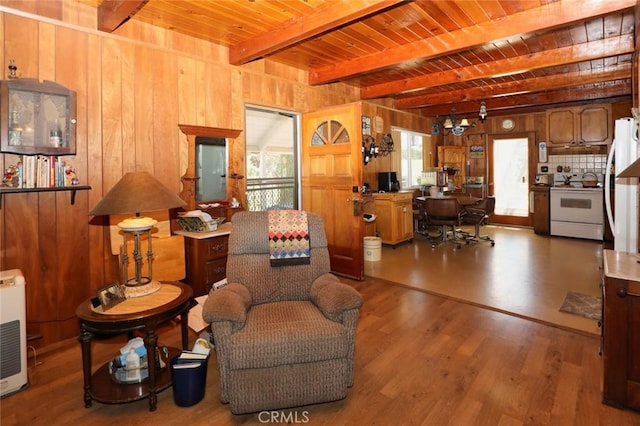 living room featuring wood-type flooring, beamed ceiling, wooden walls, and wooden ceiling