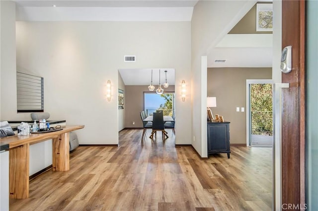 entrance foyer with hardwood / wood-style floors and a healthy amount of sunlight