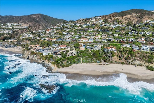 aerial view with a beach view and a water and mountain view