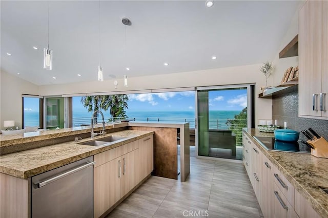 kitchen featuring dishwasher, pendant lighting, sink, a water view, and light brown cabinetry